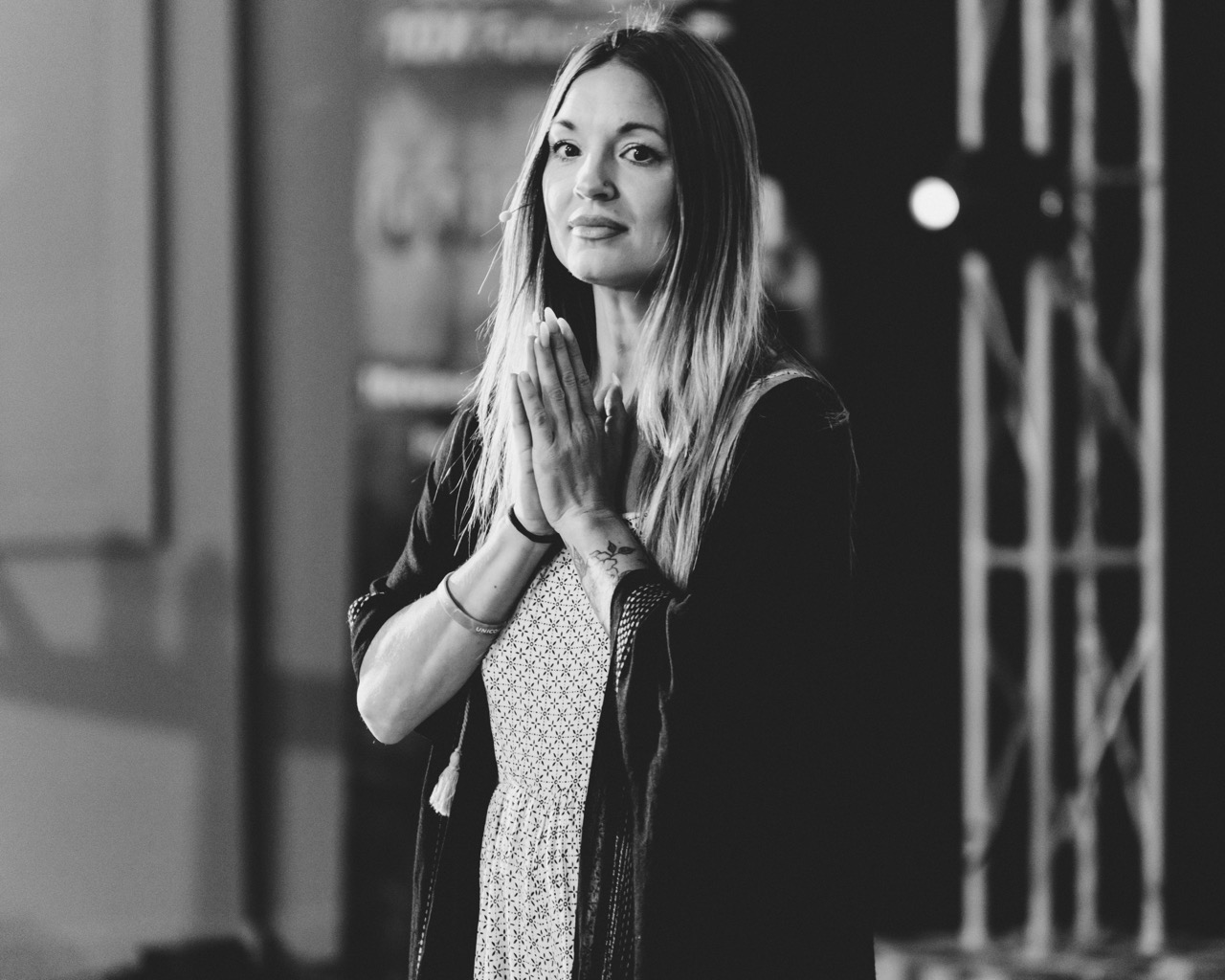 Mary Hope in prayer on stage